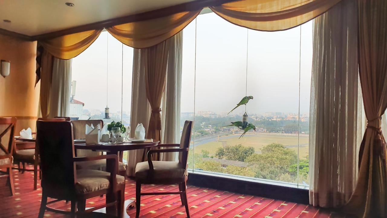 The Orchid Hotel Mumbai Vile Parle Exterior photo Parrots at the hotel